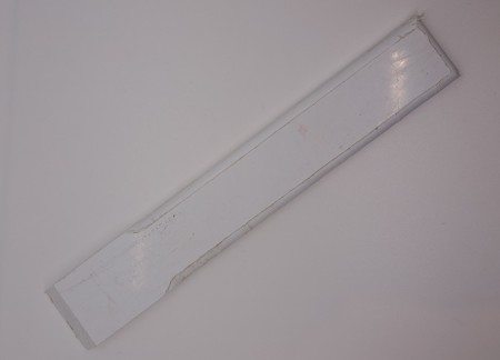 En hånds fettskrape i plast