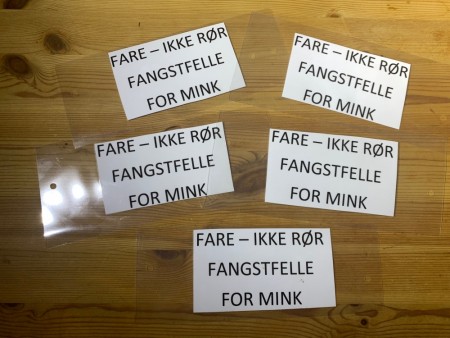 Fareskilt for minkfangst